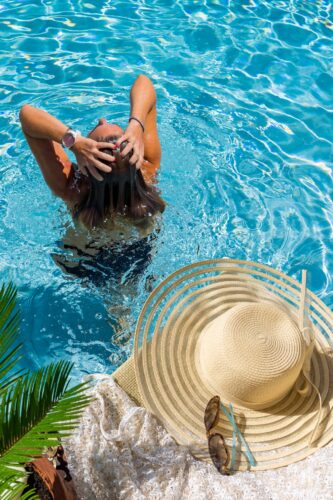 woman in newly remodeled swimming pool